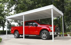 White carport sheltering a red pickup truck