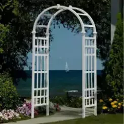 White Athens arbour with lattice sides overlooking a lake