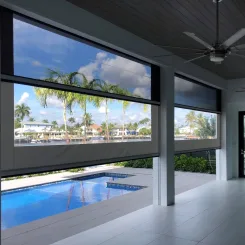 Retractable vinyl screens framing a poolside lanai with palm trees beyond