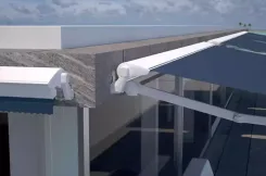 Close-up of a retractable awning arm and mounting bracket on a roof edge