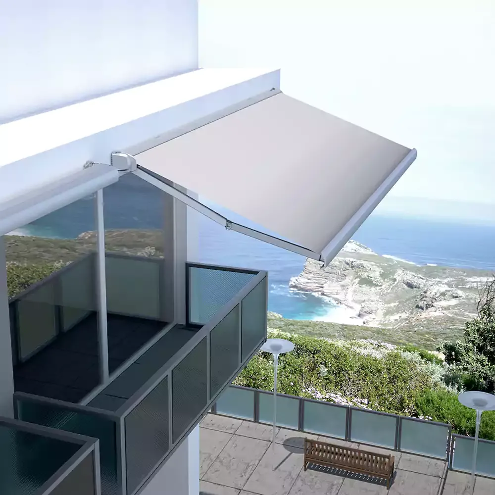 Retractable awning extended over a coastal balcony
