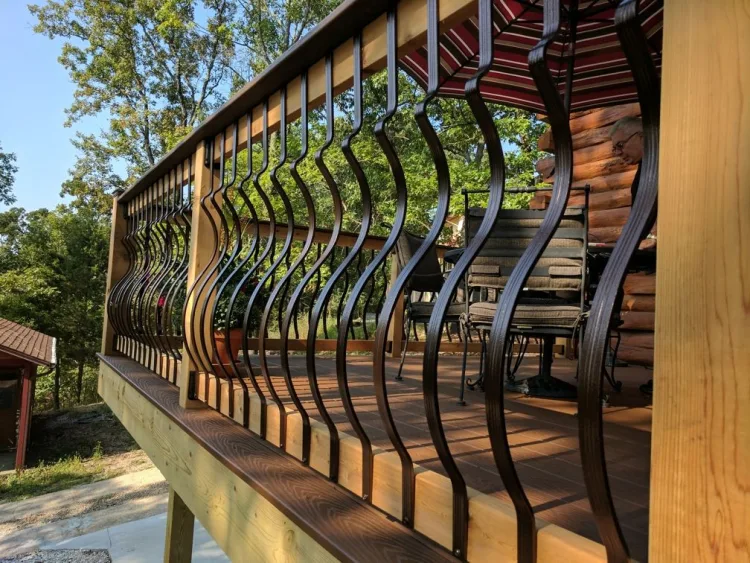 Close-up of curved metal balusters on a deck railing