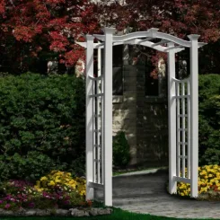 White Florence arbour with lattice sides among shrubs