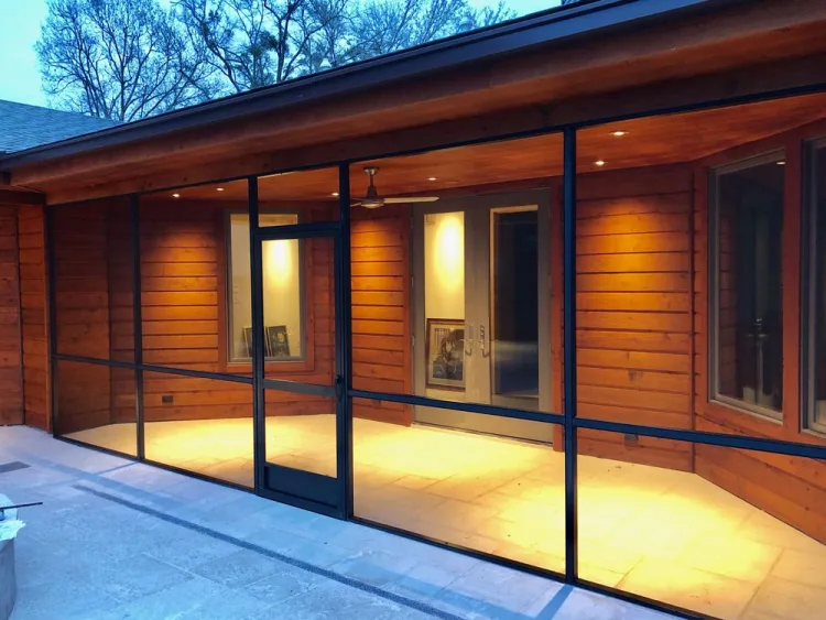 Lit screened verandah with timber cladding at dusk