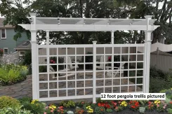 White vinyl pergola with a lattice privacy trellis screening a patio seating area