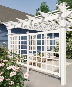 White vinyl pergola with a lattice privacy trellis beside climbing roses