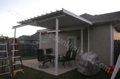 Patio cover installation in progress viewed from the garden