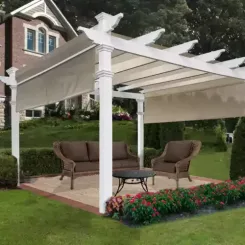 White pergola over a paved patio with wicker seating
