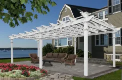 White pergola over a waterfront patio with wicker seating