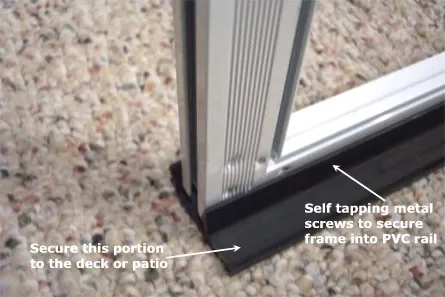Close-up of a PVC rail showing where to secure it to the deck and the self-tapping screws into the rail