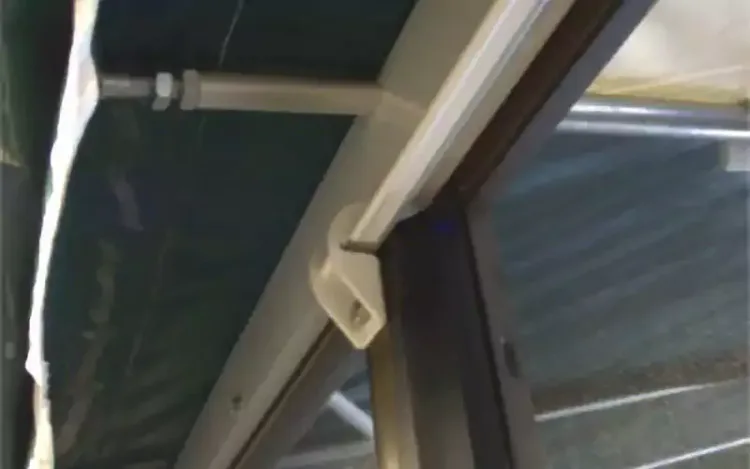 Close-up of a replacement vinyl top fixing on a screen room frame