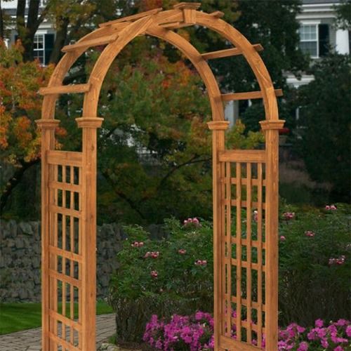 Cedar Rosewood arched arbour with lattice sides among flowers