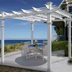 White Venetian pergola over a coastal patio with a dining set