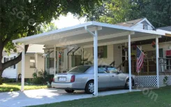 White W pan carport attached to a house with a car parked beneath